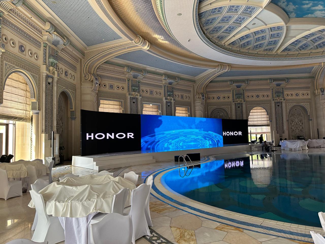 HONOR launch stage set beside the ballroom pool at the Ritz-Carlton Riyadh.